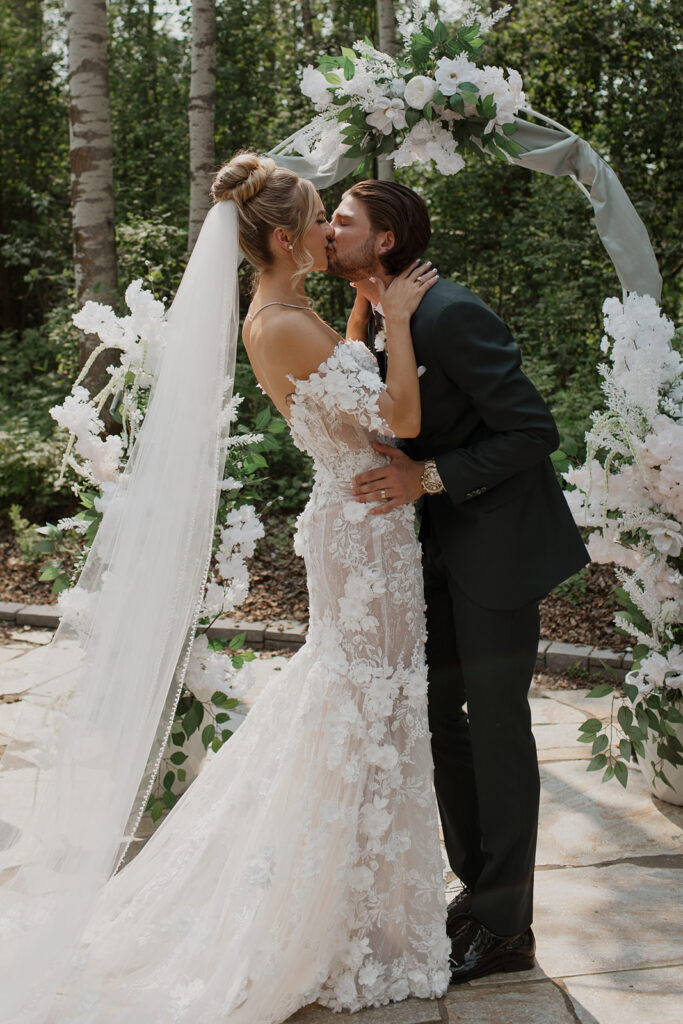 Bride and groom's first kiss at Sparrow Lane venue.